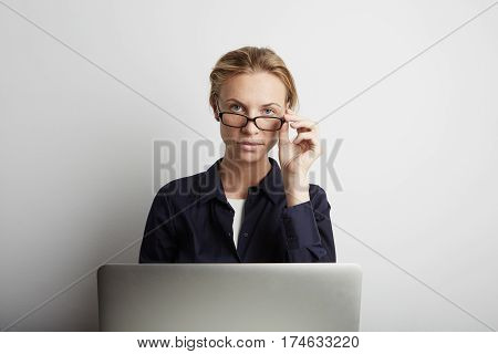 Portrait of a serious businesswoman working in office.
