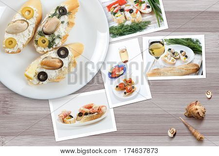 Beautiful snapshots of various italian sandwiches with seafood arranged on rustic wooden background with plates with food and seashells with copy space horizontal top view.