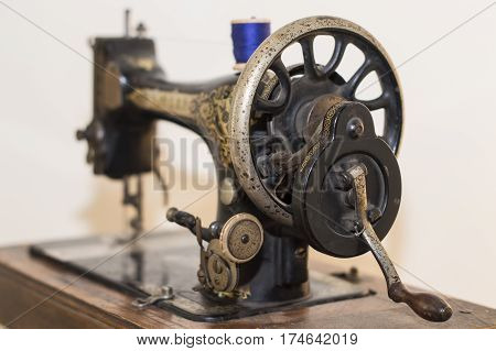 Vintage isolated sewing machine with spool of thread