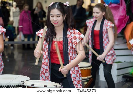 Moscow, Russia - March 5, 2017: Group Of Japanese Taiko Drummers Girls Perform In 