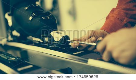 Ski Repair Shop Worker Adjust The Bindings