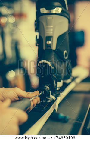 Ski Repair Shop Worker Adjust The Bindings