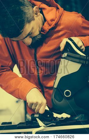 Ski Repair Shop Worker Adjust The Bindings