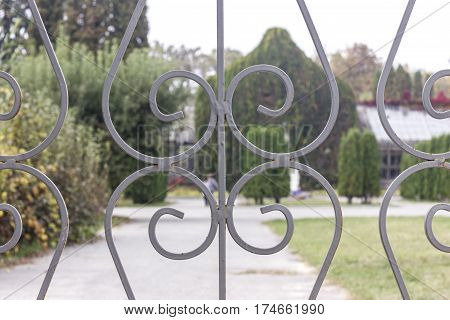 Old rusty iron fence grey color close-up