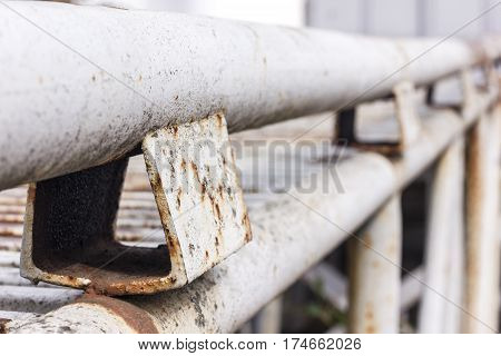 Old rusty metal square pipes. Abstract cover