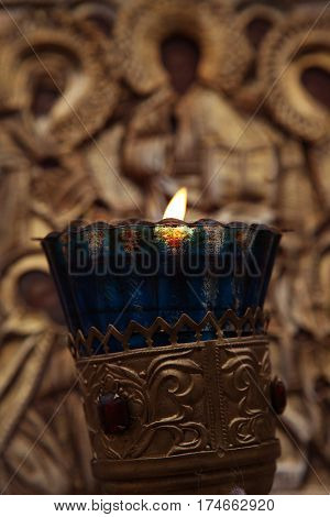 glass icon lamp in front of the antique icon of Christ the Savior