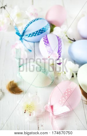 Decorated Easter eggs on a white background with flowers