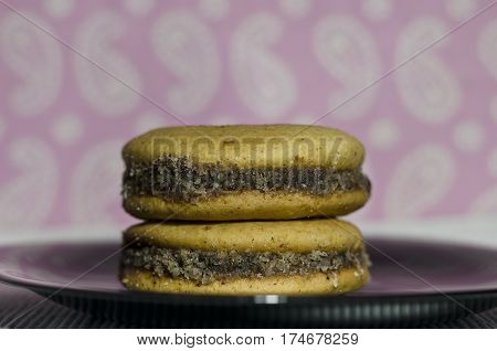 Homemade honey cookies with walnut stacked with jam