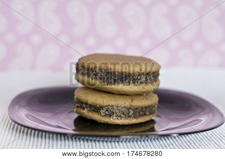 Homemade honey cookies with walnut stacked with jam