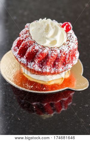 Close-up of velvet colour saravin spongy cake with white cream