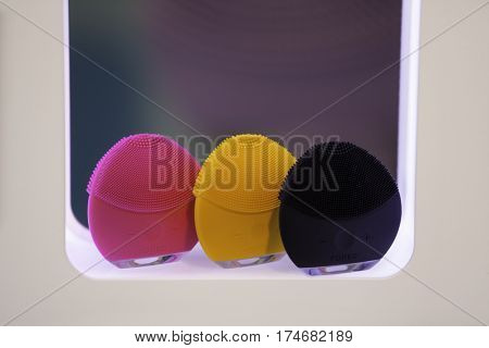 ZAGREB, CROATIA - MARCH 2nd, 2017: Close-up view a LUNA mini facial cleansing brush from FOREO in pink, orange and black