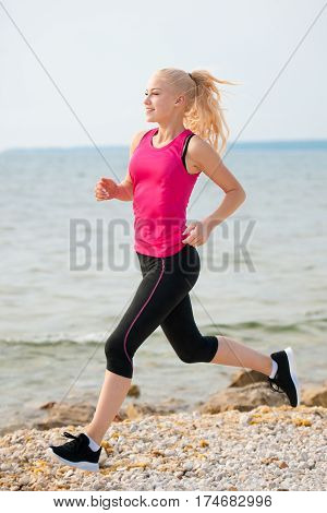 Jogging In Th Beach - Woman Runns Near Sea On Early Summer Morning