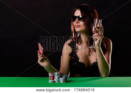 pretty young woman gambling on green table