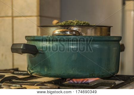 Medical Marijuana Leafs Butter Cooking With Water