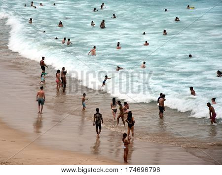 Sydney Australia - Feb 5 2017. People relaxing swimming and sun bathing on Bondi beach. Bondi beach is one of the most famous tourist sites in Australia.