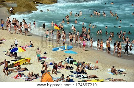 Sydney Australia - Feb 5 2017. People relaxing swimming and sun bathing on Tamarama beach.