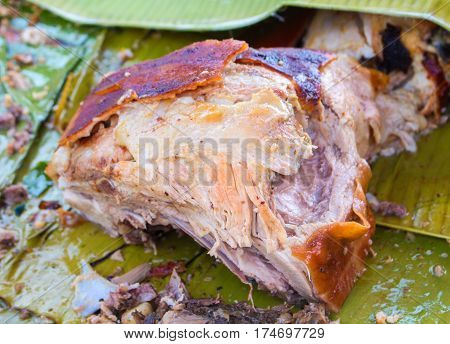 Juicy pork meat cooked on grill. Traditional cuisine of Spain. Sliced pork barbecue with gold skin. Spanish dish lechon close image for restaurant menu or eatery illustration. Tasty meat ready for eat