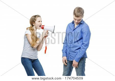 Teen age girl screaming at boy through megaphone. Brother and sister isolated on white background. Copy space.
