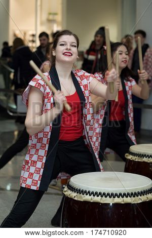 Moscow, Russia - March 5, 2017: Group Of Japanese Taiko Drummers Girls Perform In 