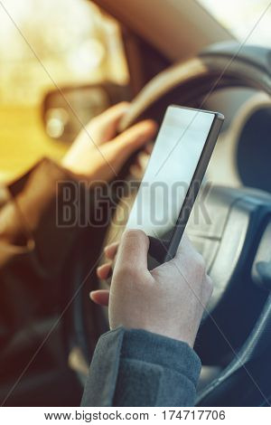 Driving car and using mobile phone to send text message is dangerous behaviour in traffic that could cause accident