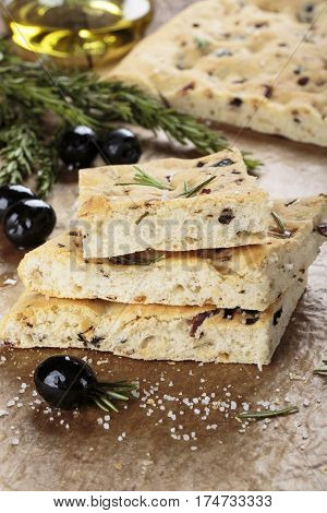 Italian focaccia bread with olives and rosemary.