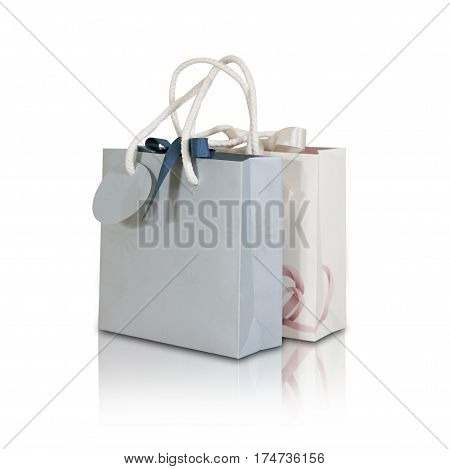 Blank Two Paper Gift Bag Mock Up Standing On A Wooden Table. Empty Plastic Package Mockup Stand On T