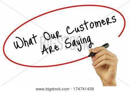 Man Hand Writing What Our Customers Are Saying With Black Marker On Visual Screen. Isolated On White