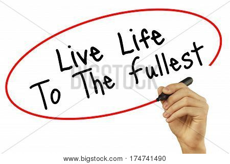 Man Hand Writing Live Life To The Fullest With Black Marker On Visual Screen. Isolated On Background
