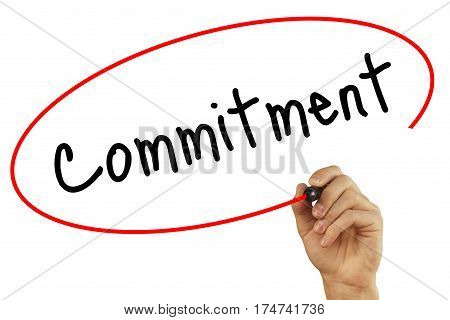 Man Hand Writing Commitment With Black Marker On Visual Screen. Isolated On Background. Business, Te
