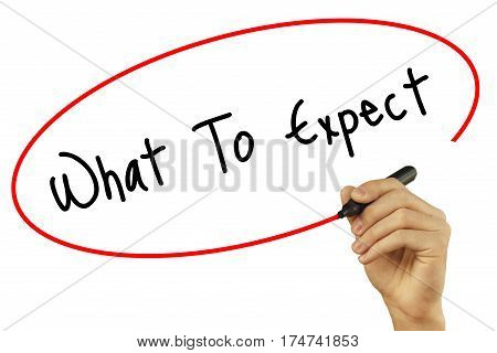 Man Hand Writing What To Expect With Black Marker On Visual Screen. Isolated On Background. Business