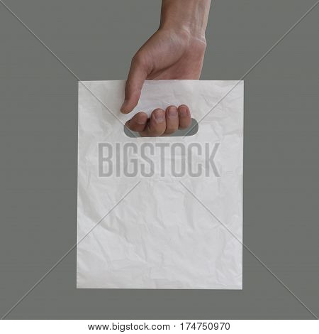 Blank Plastic Bag Mock Up Holding In Hand. Empty Polyethylene Package Mockup Hold In Hands Isolated