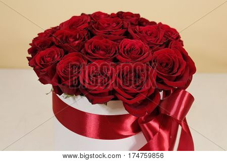 Rich Gift Bouquet Of 21 Red Roses. Composition Of Flowers In A White Hatbox. Tied With Wide Red Ribb