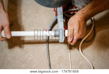 Plumber Weld Two Pieces Of White Polypropylene Pipes