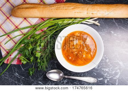 Vegetables And Meat In Red Beetroot Soup Or Borsch In White Plate On Dark Marble Background.