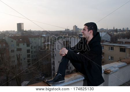Beautiful sunsets and views of the city while I photographing Danila Mazić in black coat and black pants, Novi Sad, Serbia