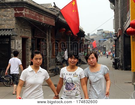 Beijing, China - Jul 4, 2011: Chinese Girls At Yandan (pipe) Hutong. This Ancient Street Is Very Pop