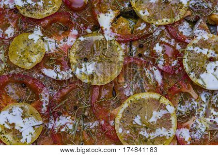 Salmon roasted in an oven with a butter parsley and garlic. Portion of cooked fish and fresh lemon on a white plate on the wooden table Salmon fillet with rosemary and lemon preparing a red fish