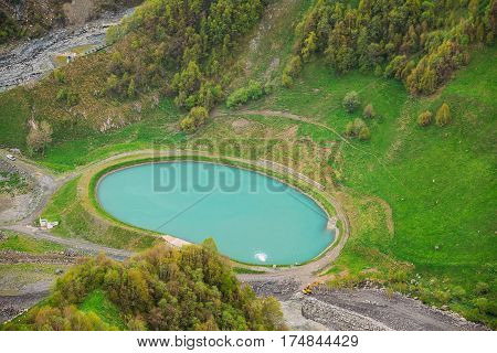 Aerial View Of Pond For Fish Farming In Fisheries In Gudskoye Gorge In Georgia, Mtiuleti Region. Spring Mountain Landscape.