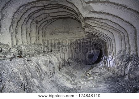 Concept of Alien, Prometheus. Abandoned chalk mine tunnel with fantastic traces of drilling machine, Belgorod, Russia