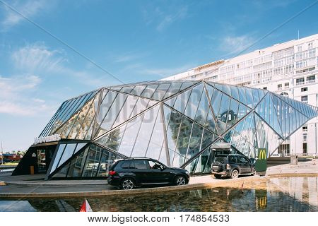 Batumi, Adjara, Georgia - May 25, 2016: Cars On Mcdrive way near modern building of McDonalds restaurant. McDonald's Corporation is the world's largest chain of hamburger fast food restaurants