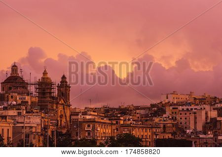 Pink Evening In Cospicua And View To Immaculate Conception Church
