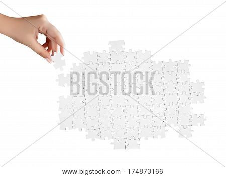 Hand Holding A Piece Of White Uncompleted Puzzle