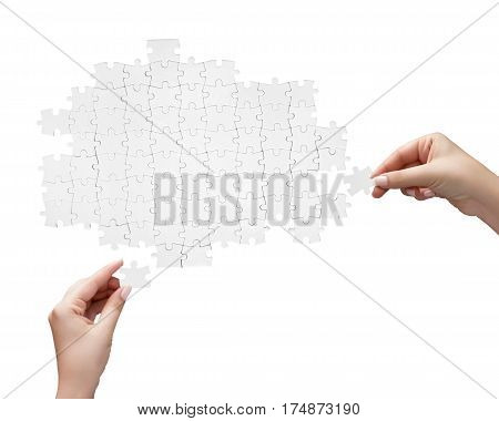 Hand Holding A Piece Of White Uncompleted Puzzle