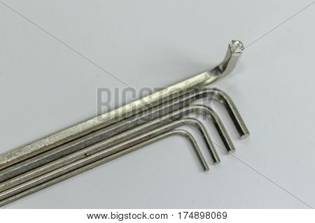 Hex key Set on white background.A hex key, Allen key or Allen wrench is a tool used to drive bolts and screws with hexagonal sockets in their heads.