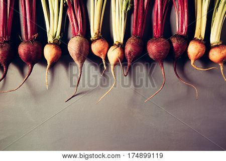 Mix Of Red And Gold Beets On Grey Background. Food Background. Concept Of Healthy Eating