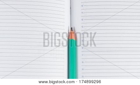 Simple pencil on the open pages of the diary place for writing text for drawing