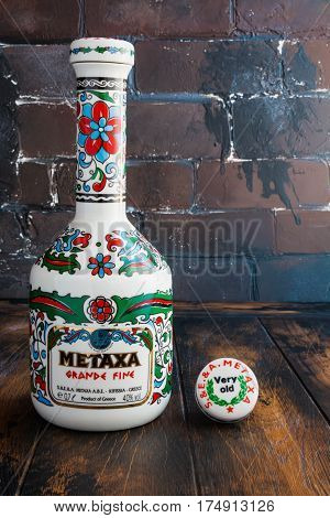 MOSCOW RF - FEBRUARY 7 2017: Bottle of Metaxa Grande Fine on a wooden table.