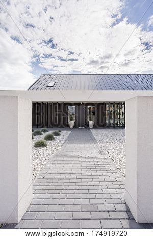 Porch of modern villa with cobbled path