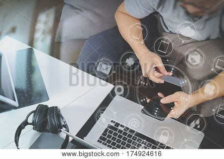Hipster Hand Using Smart Phone And Laptop Compterdigital Tablet Docking Keyboardholding Cradit Card 