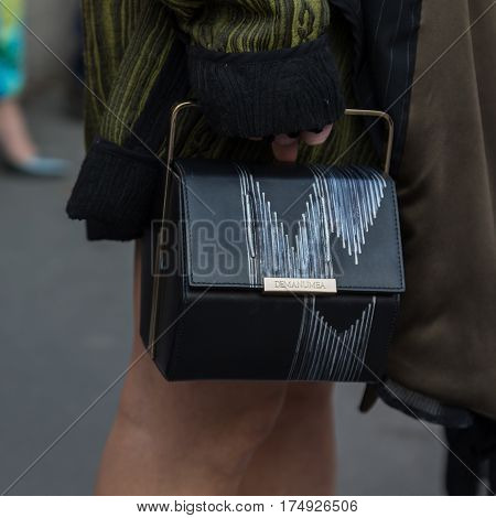 MILAN ITALY - FEBRUARY 25: Detail of bag outside Antonio Marras fashion show during Milan Women's Fashion Week on FEBRUARY 25 2017 in Milan.